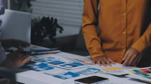 Team of UI UX web designer are working together to develop mobile responsiv.. Stock Footage 336485833