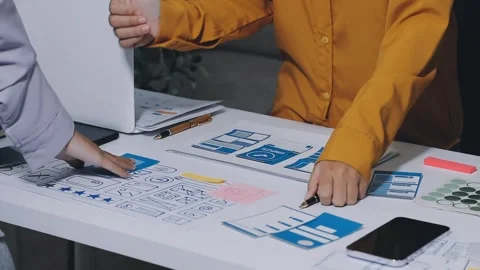 Team of UI UX web designer are working together to develop mobile responsiv.. Stock Footage 336485852