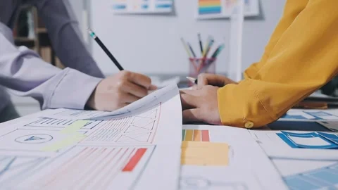 Team of UI UX web designer are working together to develop mobile responsiv.. Stock Footage 336485870