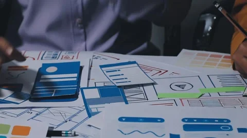 Team of UI UX web designer are working together to develop mobile responsiv.. Stock Footage 336485891