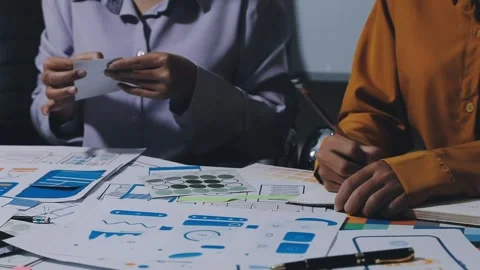 Team of UI UX web designer are working together to develop mobile responsiv.. Stock Footage 336485892