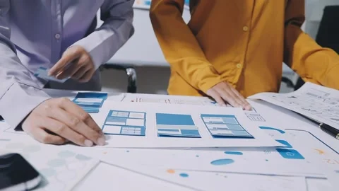 Team of UI UX web designer are working together to develop mobile responsiv.. Stock Footage 336485911