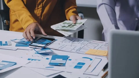 Team of UI UX web designer are working together to develop mobile responsiv.. Stock Footage 336485915