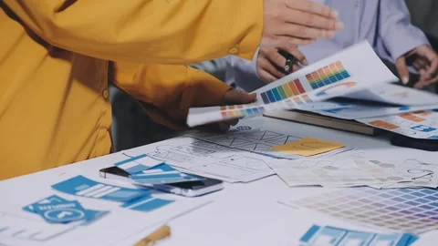 Team of UI UX web designer are working together to develop mobile responsiv.. Stock Footage 336485924