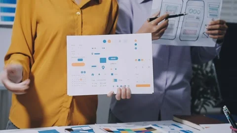 Team of UI UX web designer are working together to develop mobile responsiv.. Stock Footage 336485938
