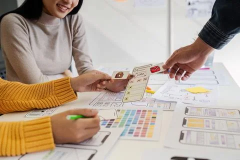 Team of UI UX web designer are working together to develop mobile responsive Stock Photos