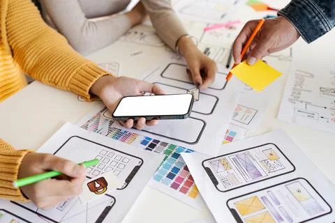 Team of UI UX web designer are working together to develop mobile responsive Stock Photos