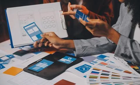 Team of UI UX web designer are working together to develop mobile responsiv.. 写真素材