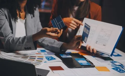 Team of UI UX web designer are working together to develop mobile responsiv.. Stock Photos