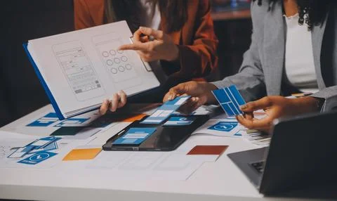 Team of UI UX web designer are working together to develop mobile responsiv.. Stock Photos