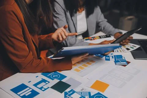 Team of UI UX web designer are working together to develop mobile responsiv.. Stock Photos