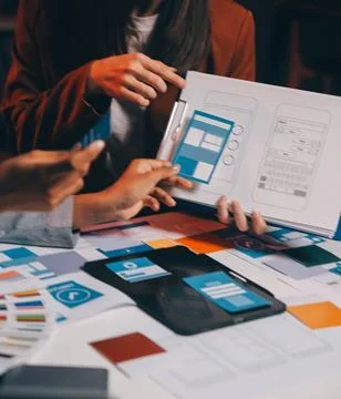 Team of UI UX web designer are working together to develop mobile responsiv.. Stock Photos