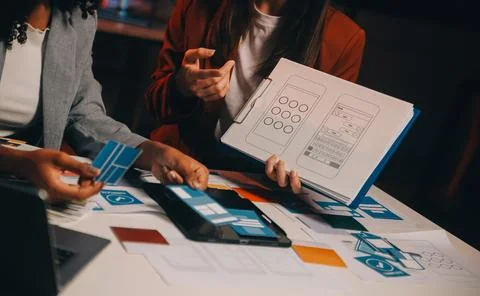 Team of UI UX web designer are working together to develop mobile responsiv.. Stock Photos