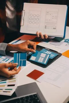 Team of UI UX web designer are working together to develop mobile responsiv.. Stock Photos