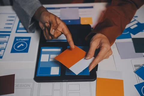 Team of UI UX web designer are working together to develop mobile responsiv.. Stock Photos