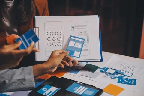 Team of UI UX web designer are working together to develop mobile responsiv.. Stock Photos