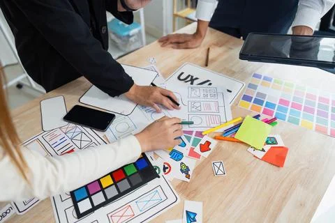 Team of UI UX web designer are working together to develop mobile responsive 写真素材