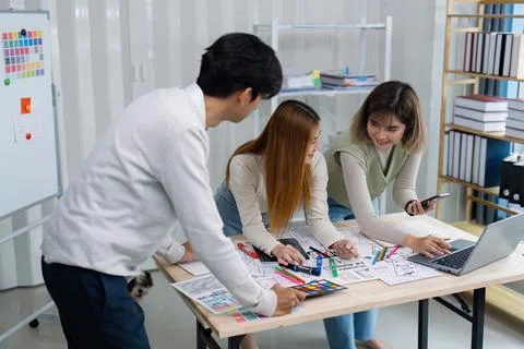 Team of UI UX web designer are working together to develop mobile responsive Stock Photos