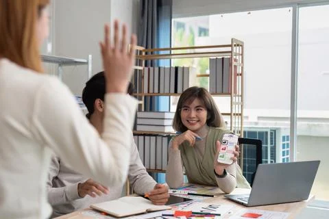 Team of UI UX web designer are working together to develop mobile responsive Stock Photos