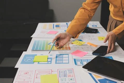 Team of UI UX web designer are working together to develop mobile responsiv.. Stock Photos