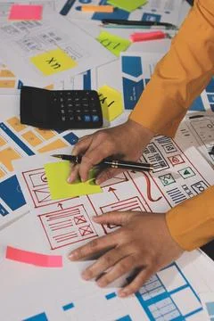 Team of UI UX web designer are working together to develop mobile responsiv.. Stock Photos