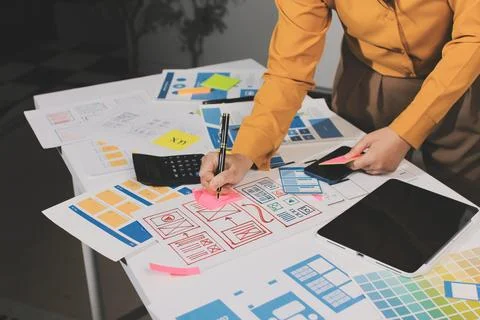 Team of UI UX web designer are working together to develop mobile responsiv.. Stock Photos