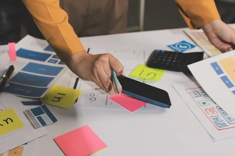 Team of UI UX web designer are working together to develop mobile responsiv.. Stock Photos