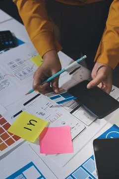 Team of UI UX web designer are working together to develop mobile responsiv.. Stock Photos