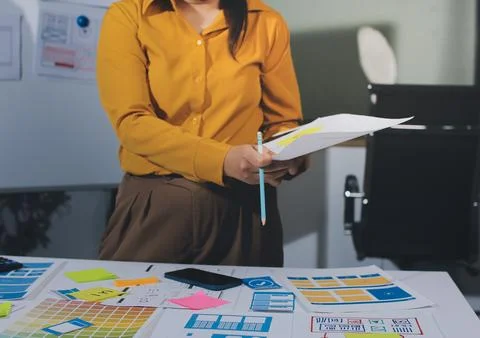 Team of UI UX web designer are working together to develop mobile responsiv.. Stock Photos