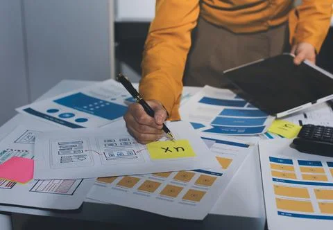 Team of UI UX web designer are working together to develop mobile responsiv.. Stock Photos