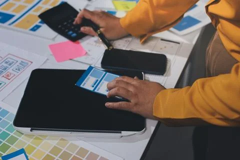 Team of UI UX web designer are working together to develop mobile responsiv.. Stock Photos