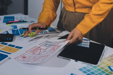 Team of UI UX web designer are working together to develop mobile responsiv.. Stock Photos
