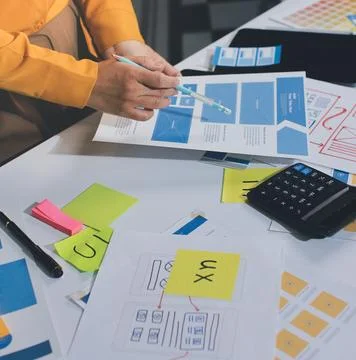 Team of UI UX web designer are working together to develop mobile responsiv.. Stock Photos