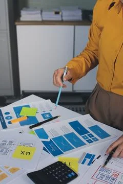 Team of UI UX web designer are working together to develop mobile responsiv.. Stock Photos