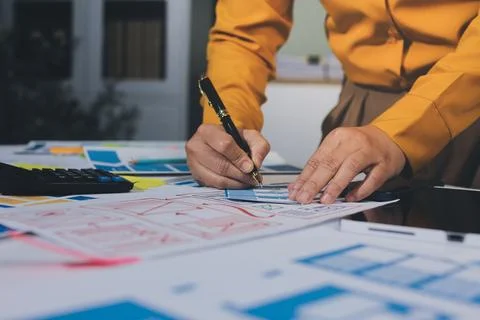 Team of UI UX web designer are working together to develop mobile responsiv.. Stock Photos