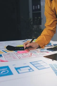 Team of UI UX web designer are working together to develop mobile responsiv.. Stock Photos