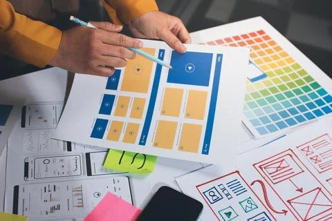 Team of UI UX web designer are working together to develop mobile responsiv.. Stock Photos
