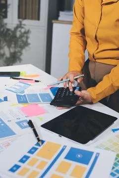 Team of UI UX web designer are working together to develop mobile responsiv.. Stock Photos