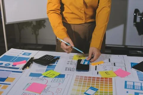 Team of UI UX web designer are working together to develop mobile responsiv.. Stock Photos