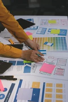 Team of UI UX web designer are working together to develop mobile responsiv.. Stock Photos