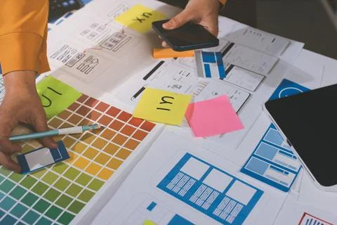 Team of UI UX web designer are working together to develop mobile responsiv.. 写真素材