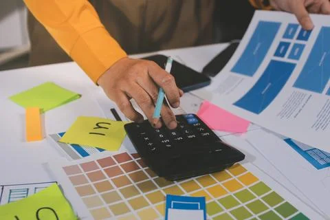 Team of UI UX web designer are working together to develop mobile responsiv.. Stockfoto's