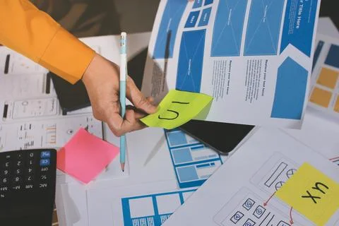 Team of UI UX web designer are working together to develop mobile responsiv.. Stock Photos