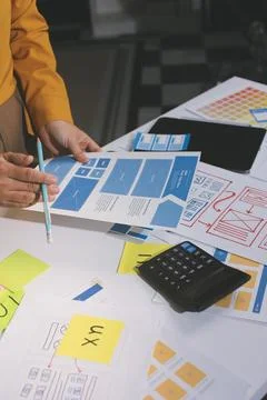 Team of UI UX web designer are working together to develop mobile responsiv.. Stock Photos