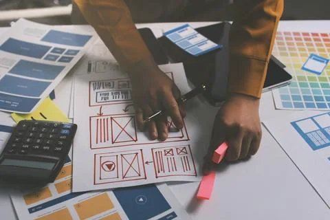 Team of UI UX web designer are working together to develop mobile responsiv.. Stock Photos