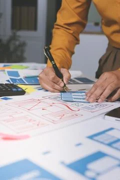 Team of UI UX web designer are working together to develop mobile responsiv.. Stock Photos