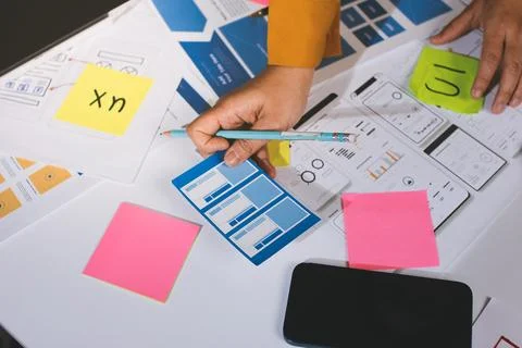 Team of UI UX web designer are working together to develop mobile responsiv.. Stock Photos