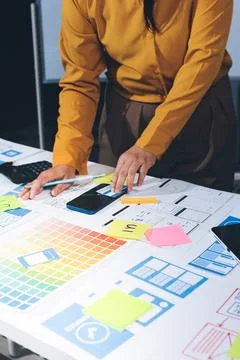 Team of UI UX web designer are working together to develop mobile responsiv.. Stock Photos