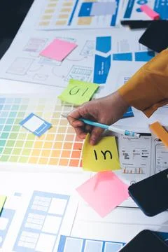 Team of UI UX web designer are working together to develop mobile responsiv.. Stock Photos