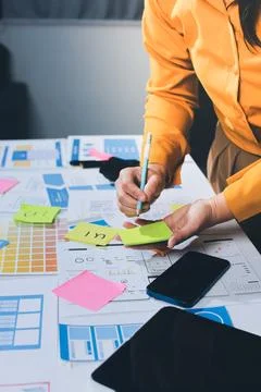 Team of UI UX web designer are working together to develop mobile responsiv.. Stock Photos